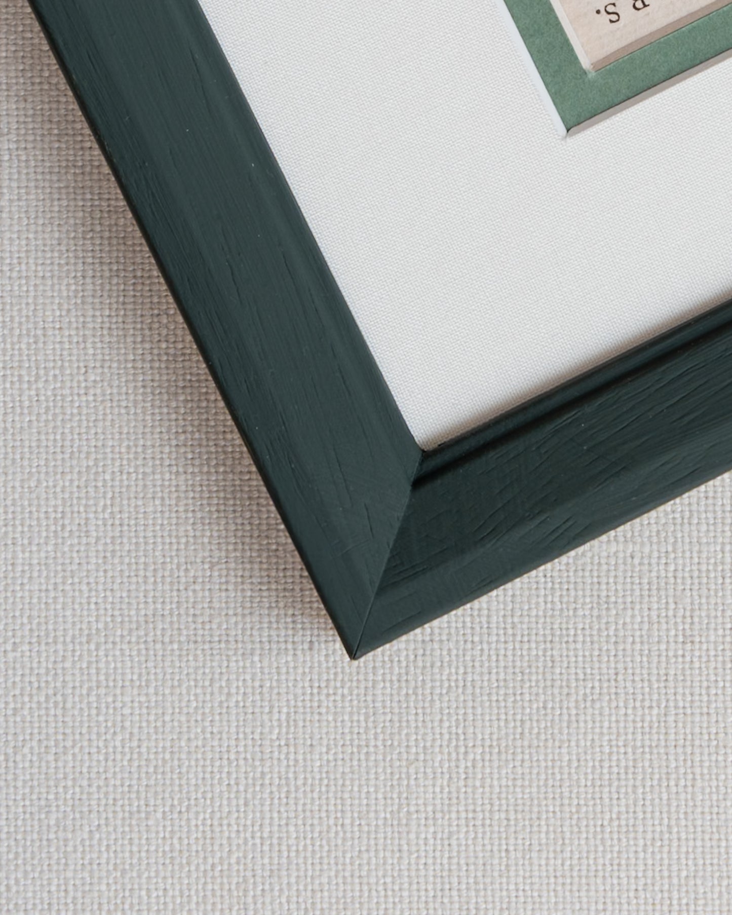 Detailed corner shot of hand painted frame with linen mount with sage green. Giddy Prints.